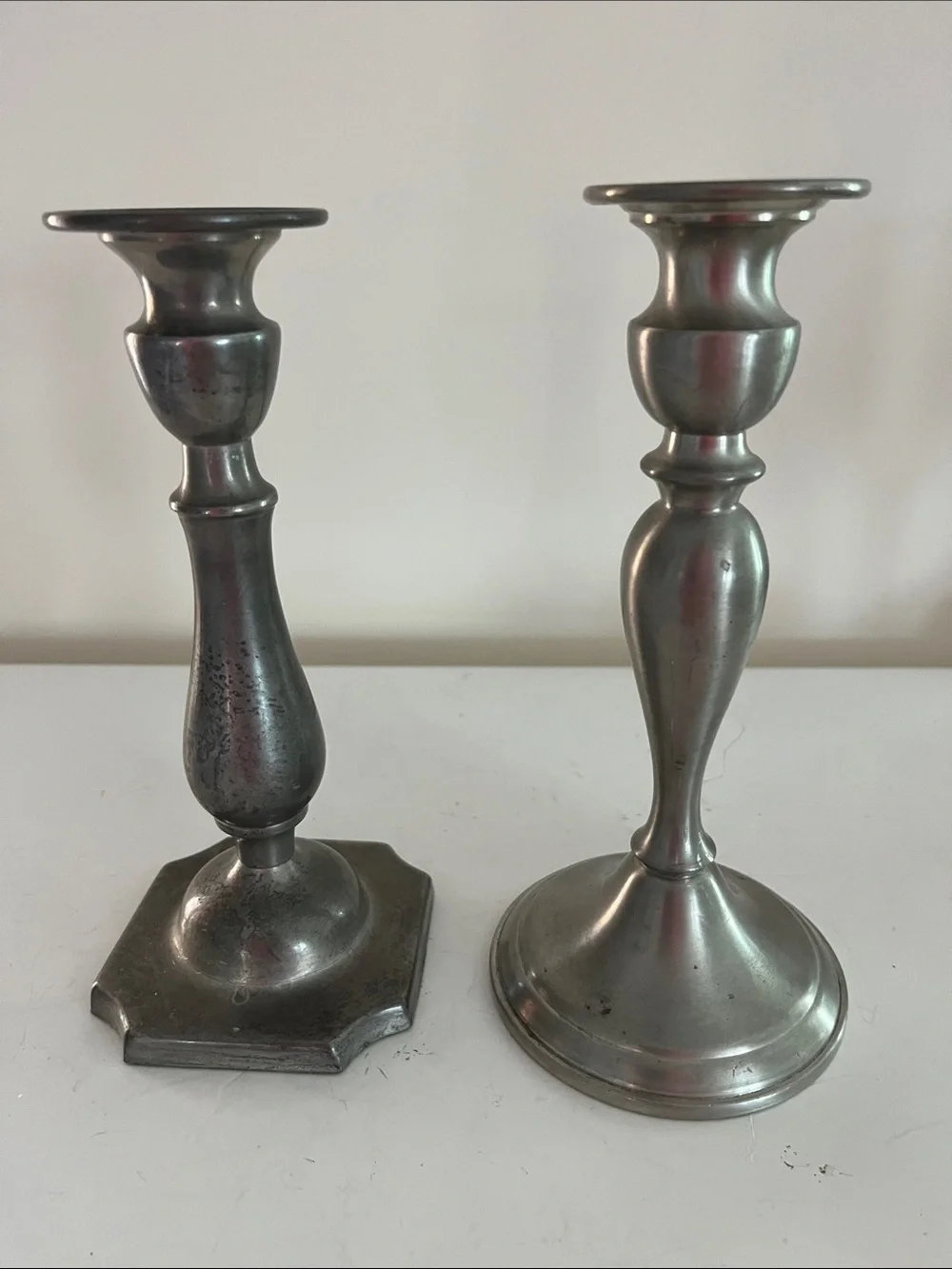 Unmatched set of 2 8 inch pewter candlesticks no visible markings